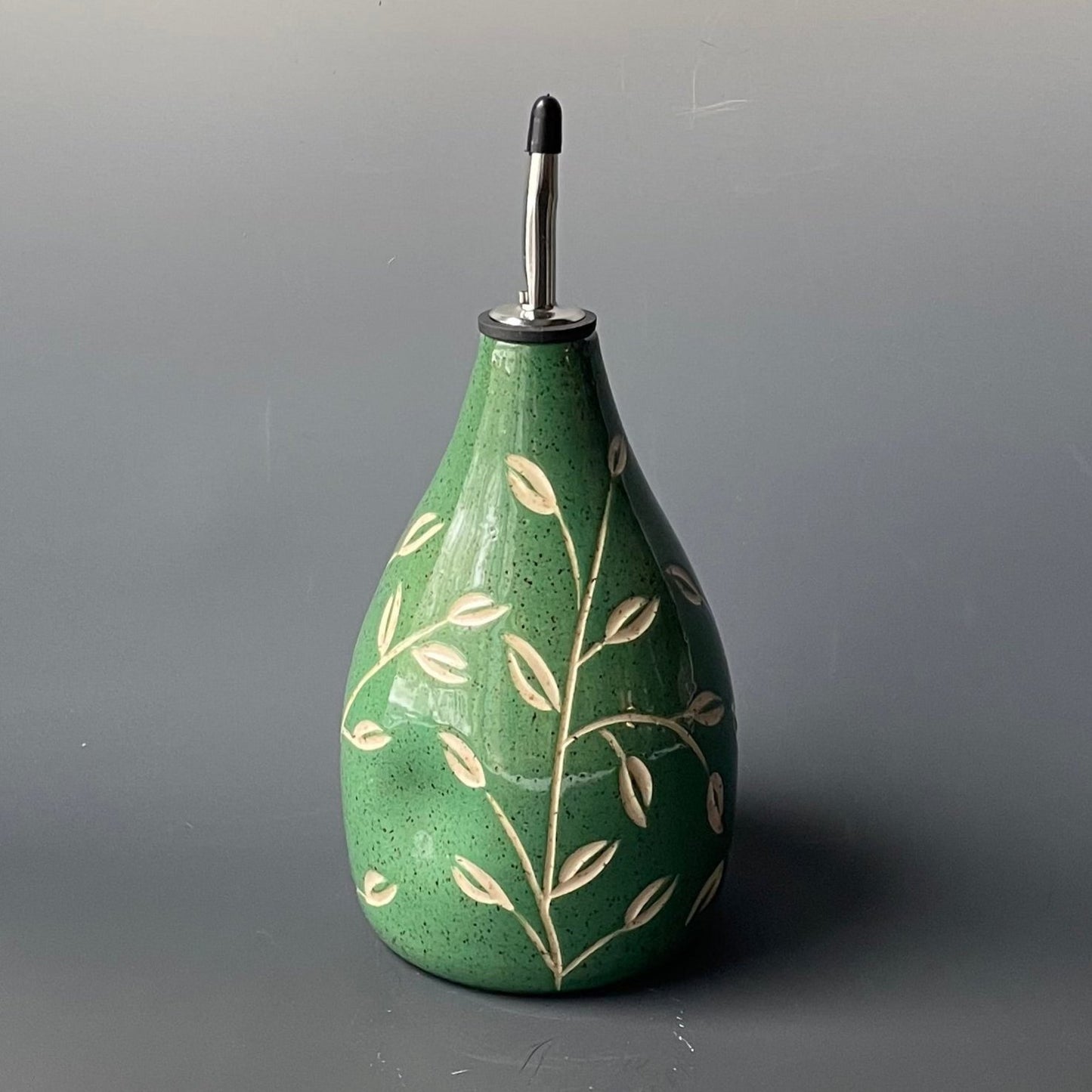 Green Leaf Carved Oil Pourer with thumb indent