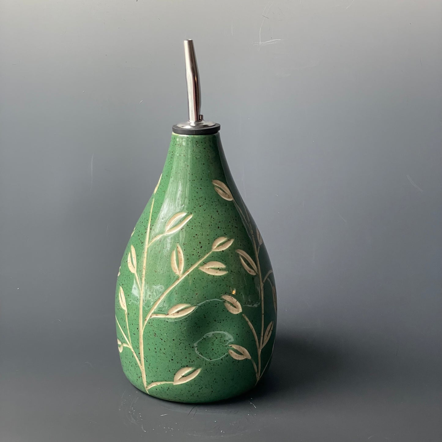 Green Leaf Carved Oil Pourer with thumb indent