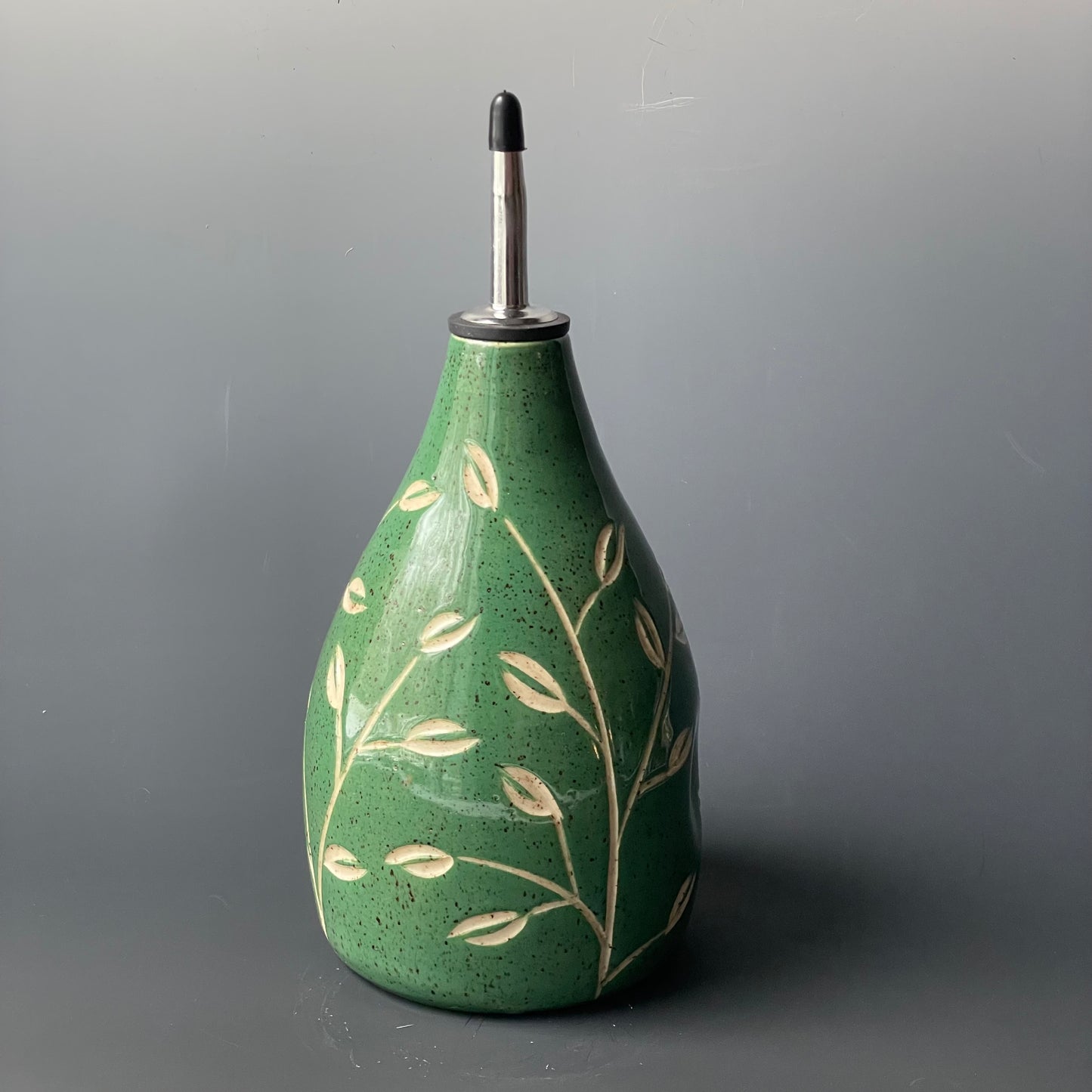 Green Leaf Carved Oil Pourer with thumb indent