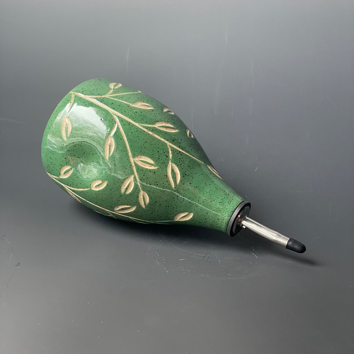 Green Leaf Carved Oil Pourer with thumb indent